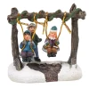 Personnage village de Noël enfants sur balancelle