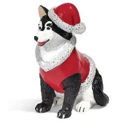 Personnage village de Noël chien avec manteau et bonnet rouge